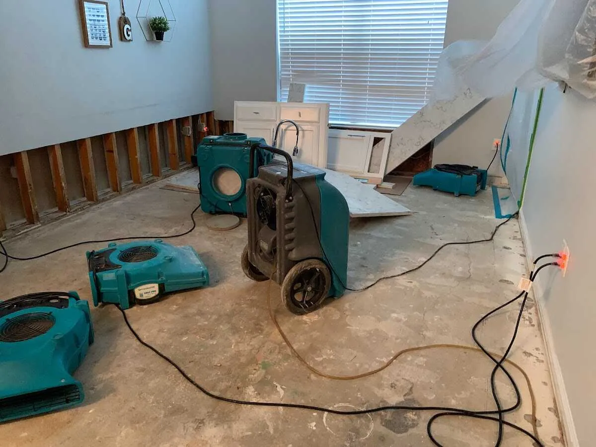 Dehumidifier in flood-cut room for Water Damage Restoration in Winston-Salem